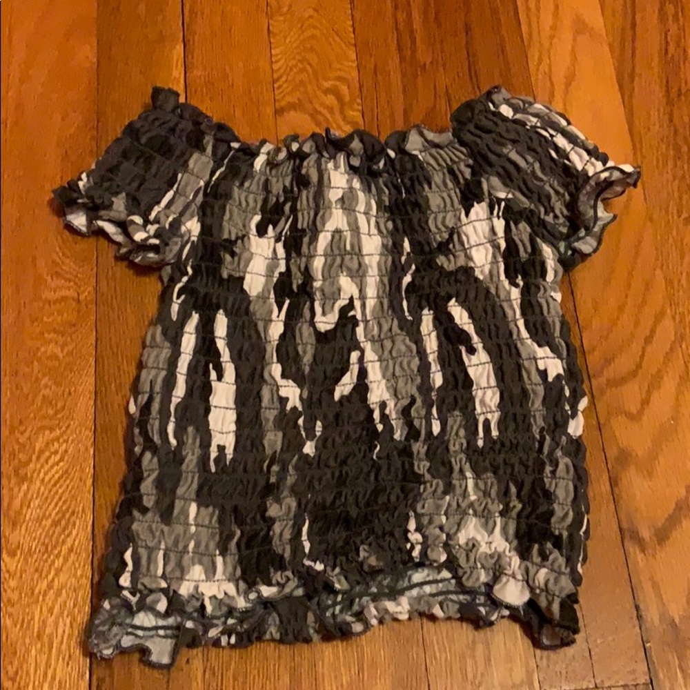 A cropped shirt that has never been worn.